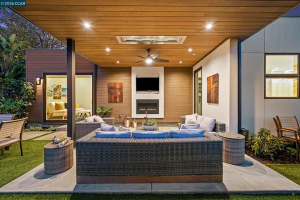 a building outdoor space with patio furniture and garden