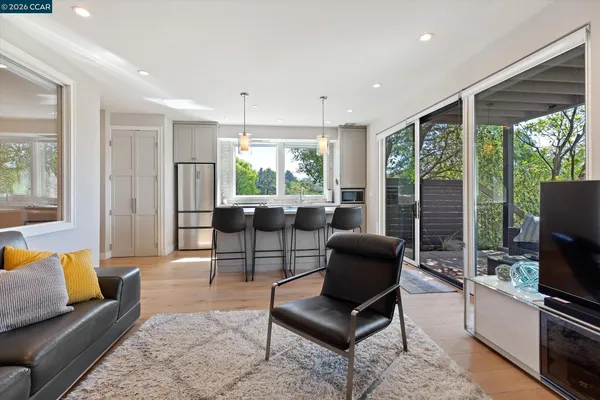 a view of a dining room with furniture window and outside view