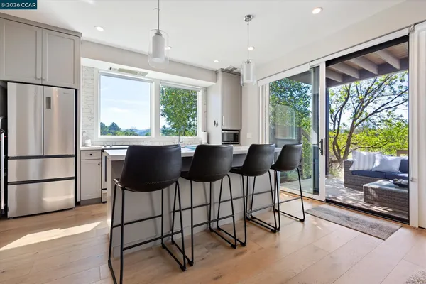 a kitchen with stainless steel appliances a stove sink and refrigerator