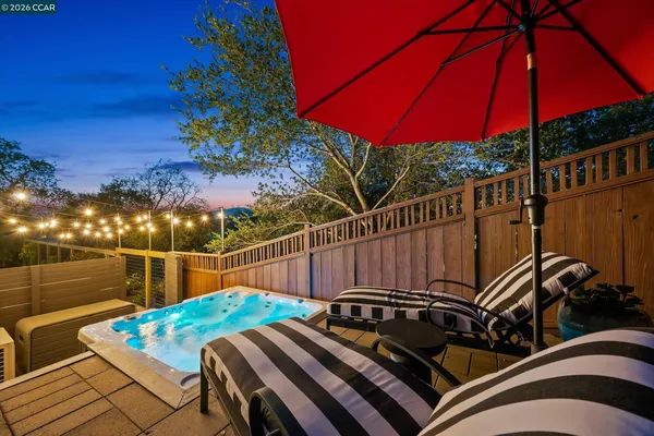 a view of a backyard with a sitting area