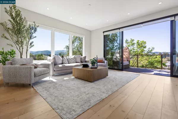 a view of a dining room with furniture window and outside view