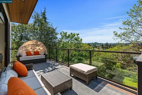 a view of a two chairs in the patio