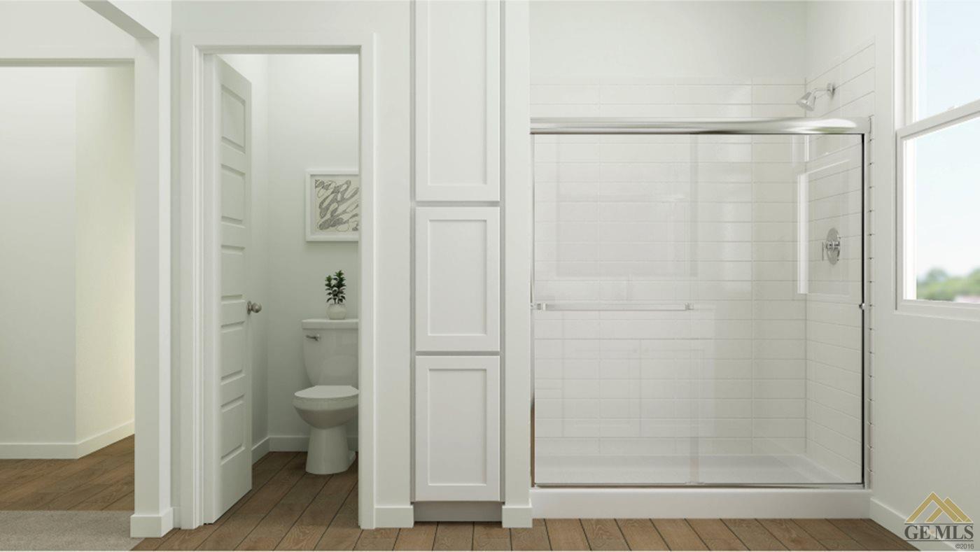 Undisclosed Address Shafter, CA 93263 - Photo 11 of 19 a bathroom with a shower and a toilet