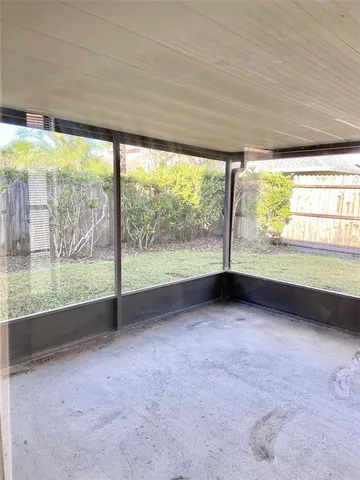 a view of an empty room with a large window