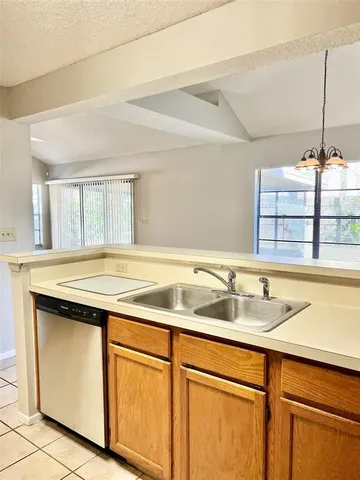 a kitchen with a sink and cabinets
