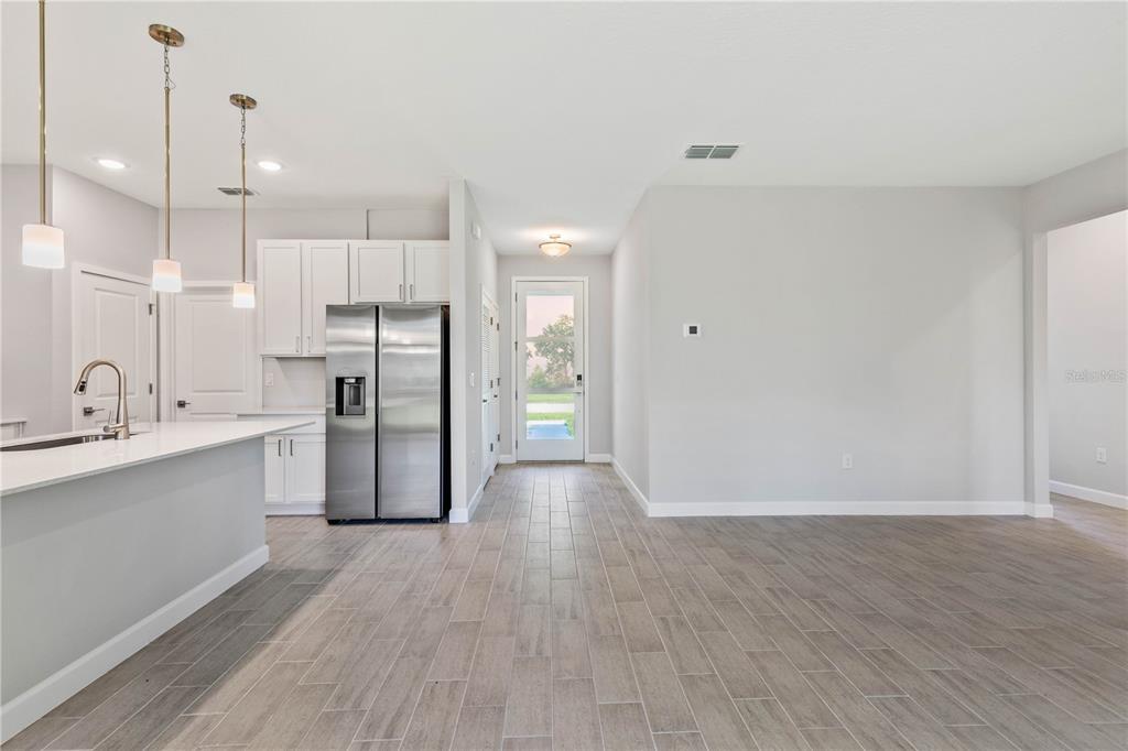 3294 Gowanda Road North Port, FL 34287 - Photo 5 of 28 a view of a kitchen with wooden floor and a sink