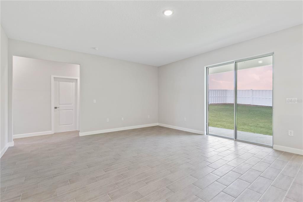 3294 Gowanda Road North Port, FL 34287 - Photo 7 of 28 an empty room with sliding glass door