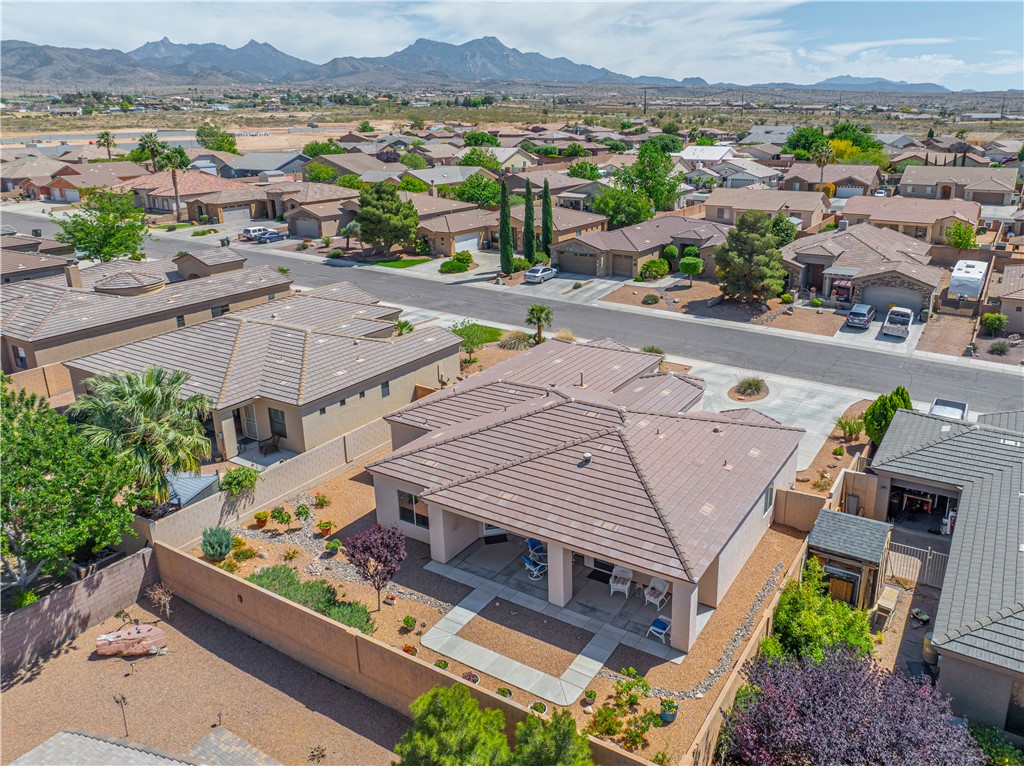 3315 Rainbow Mine Road Kingman, AZ 86401 - Photo 42 of 54 This property features a well-maintained exterior with a tiled roof and a paved patio area