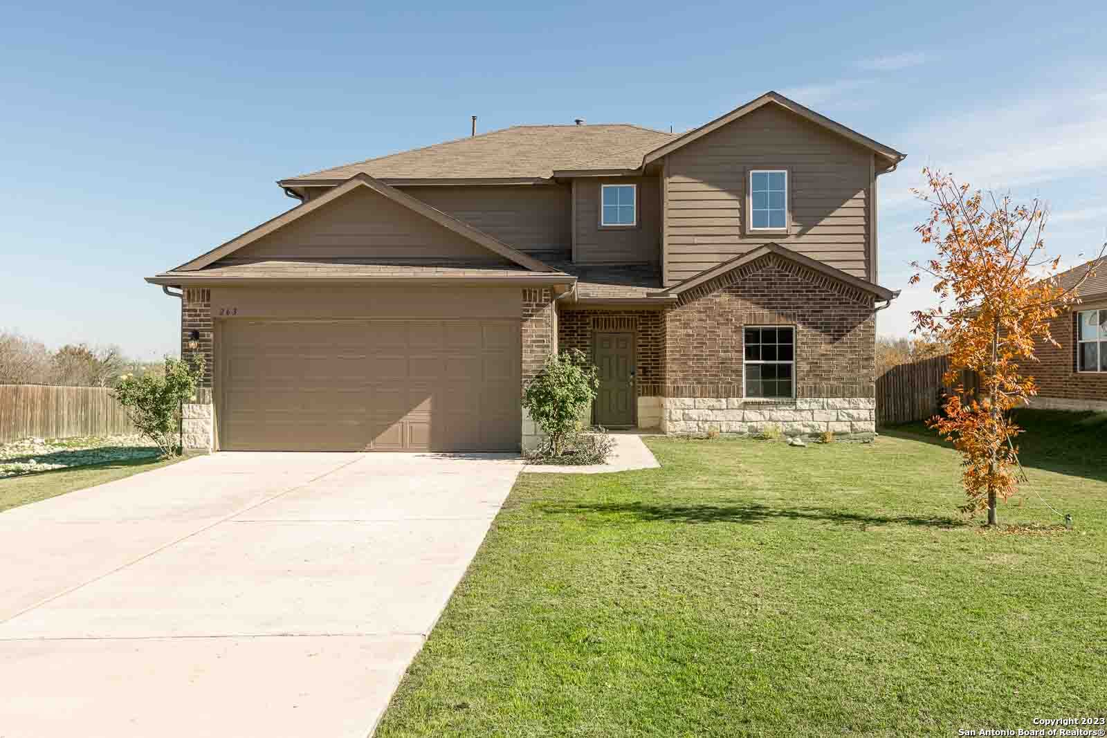 263 Kookaburra Bend Kyle, TX 78640 - Photo 1 of 1 a front view of a house with a yard