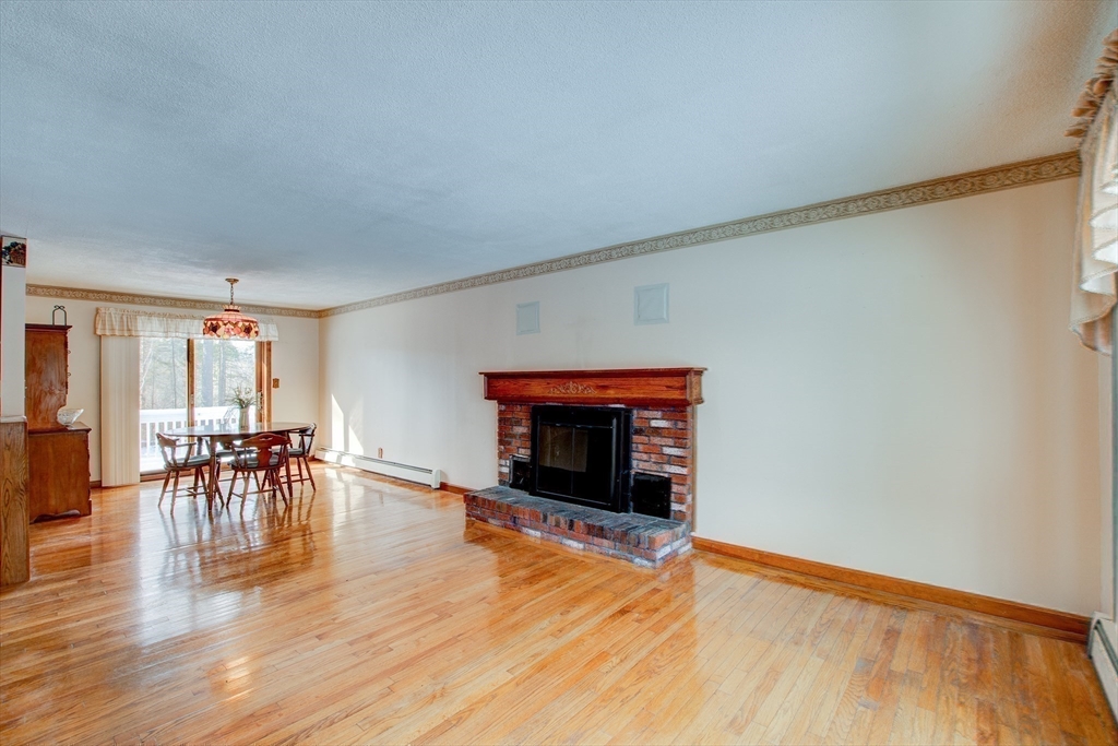207 Sherbert Road Ashburnham, MA 01430 - Photo 13 of 41 a living room with furniture and a fireplace