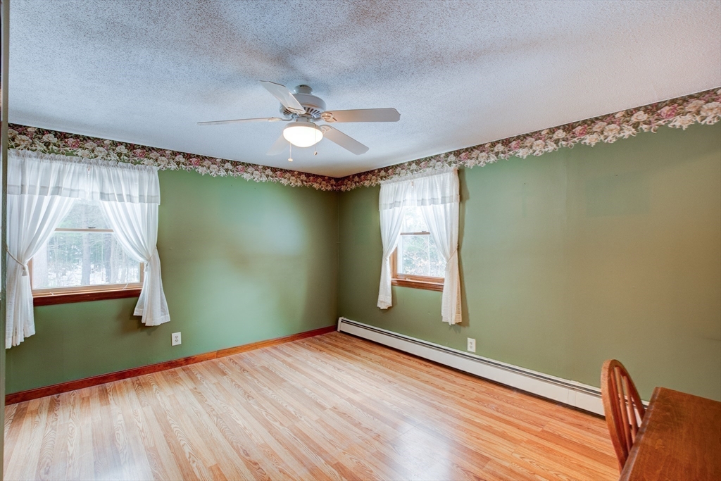 207 Sherbert Road Ashburnham, MA 01430 - Photo 17 of 41 a view of empty room with window and wooden floor