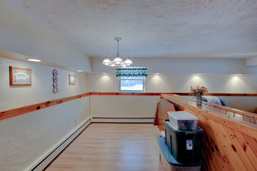 207 Sherbert Road Ashburnham, MA 01430 - Photo 30 of 41 a view of a room with wooden floor and ceiling fan