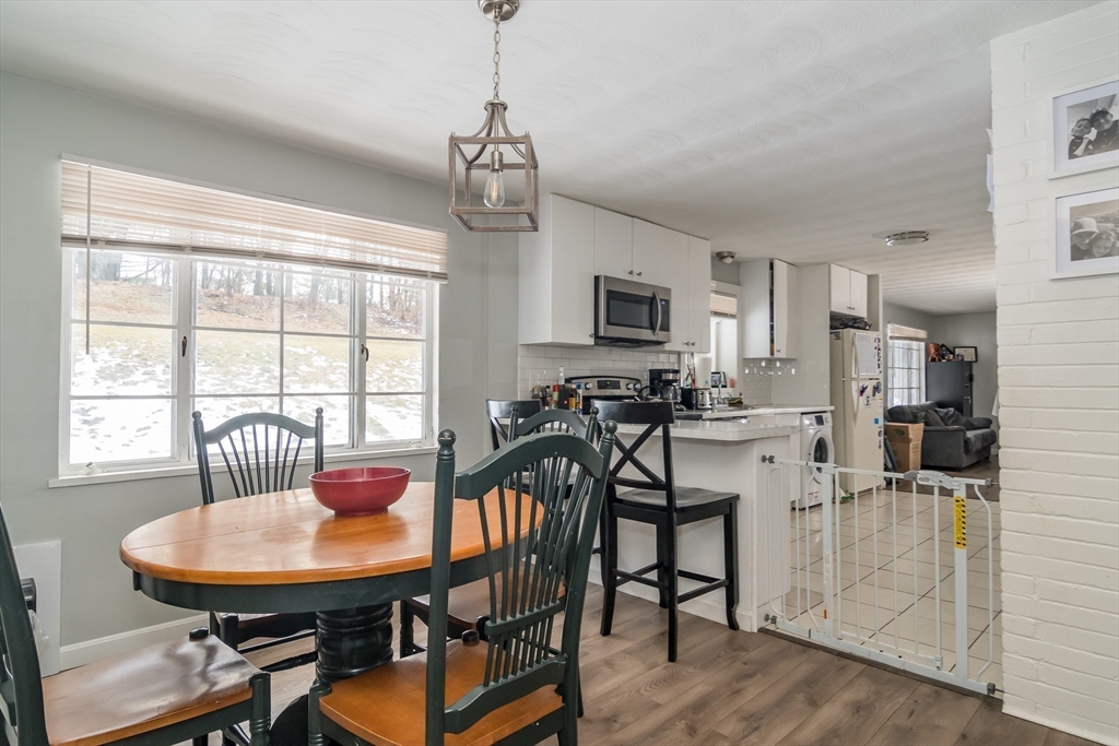 17 Francine Road Framingham, MA 01701 - Photo 5 of 14 a view of a dining room with furniture window and wooden floor