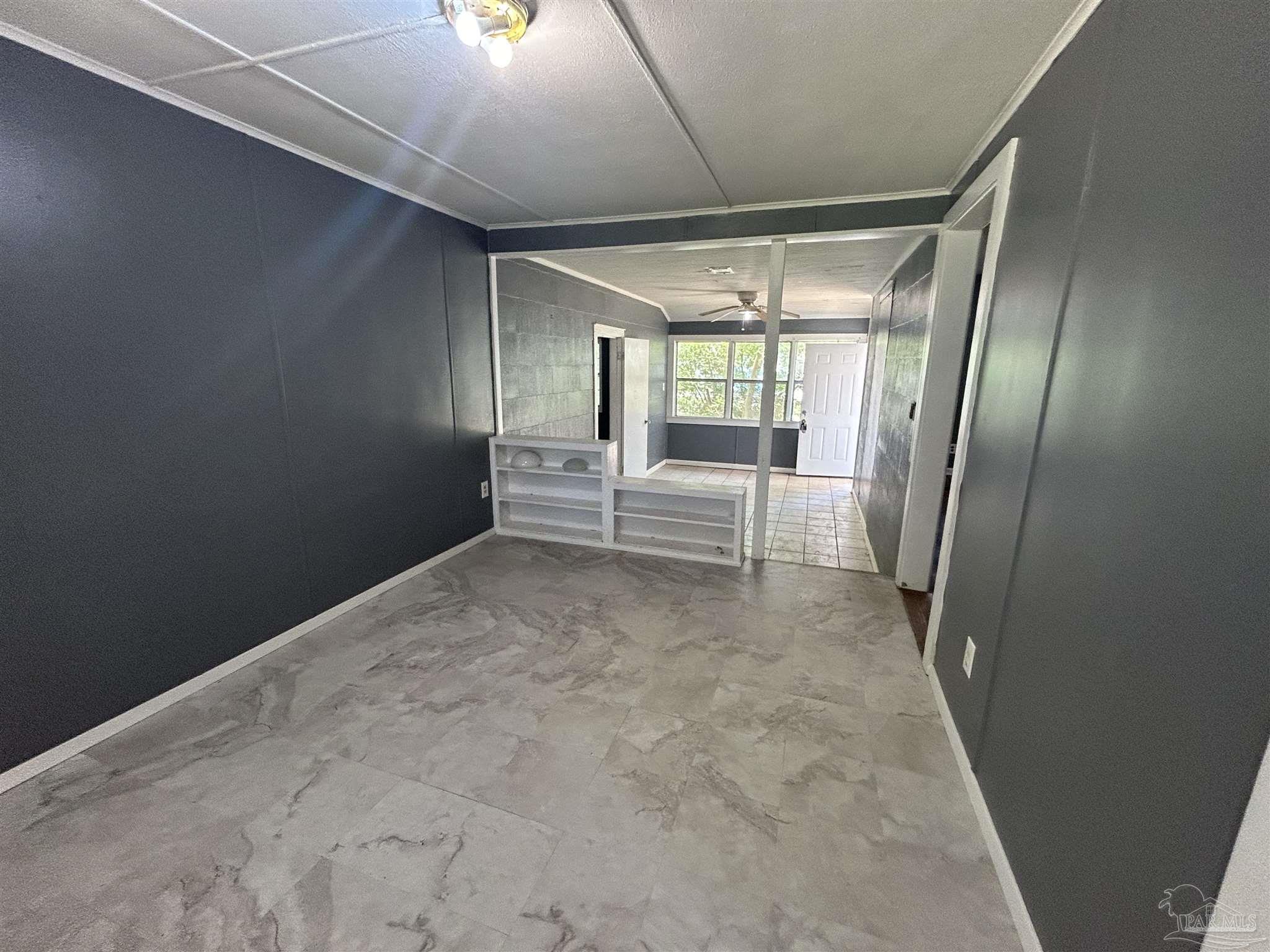 210 Milton Road Pensacola, FL 32507 - Photo 5 of 17 a view of an empty room with a fireplace