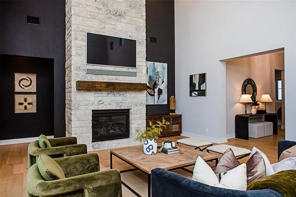 a living room with furniture and a fireplace
