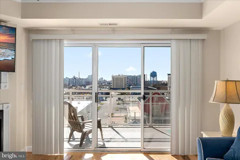 a kitchen with a window and cabinets