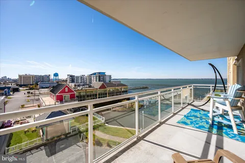 a view of a balcony with chairs