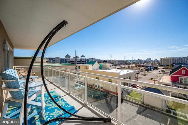 a view of a balcony with furniture
