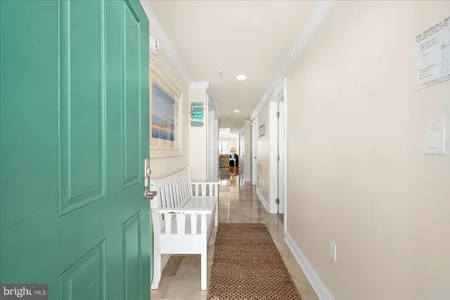 a view of a hallway with a green space