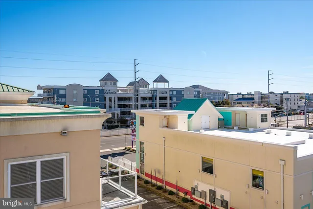 a view of a kitchen with a sink and cabinets