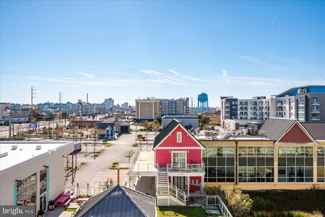 a view of multiple houses with a yard