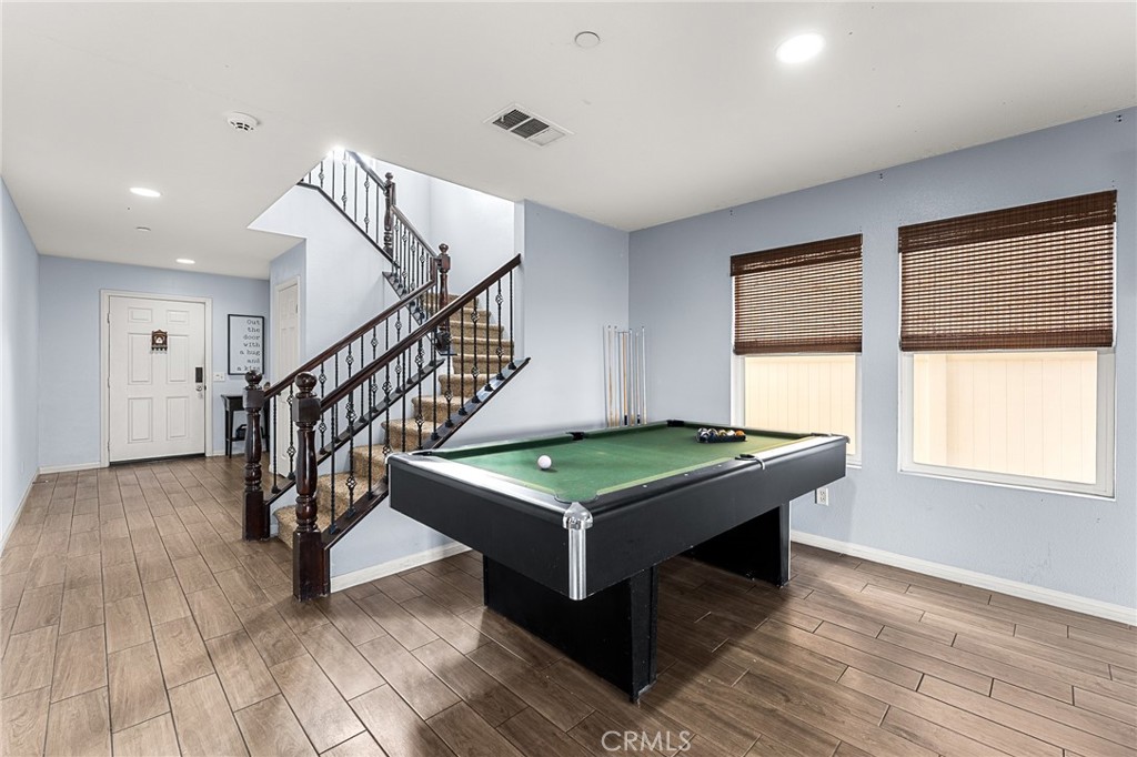 136 Yosemite Avenue Perris, CA 92570 - Photo 11 of 31 a room with pool table and windows