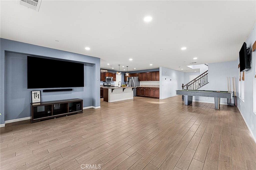 136 Yosemite Avenue Perris, CA 92570 - Photo 13 of 31 a view of a livingroom with furniture and flat screen tv