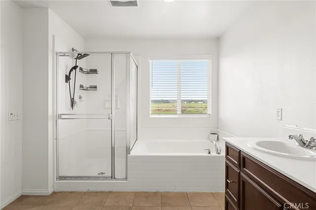 a bathroom with a bathtub and a sink