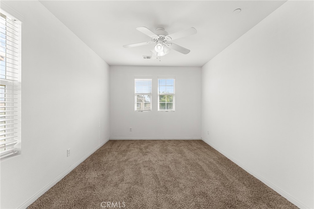 136 Yosemite Avenue Perris, CA 92570 - Photo 21 of 31 an empty room with a window