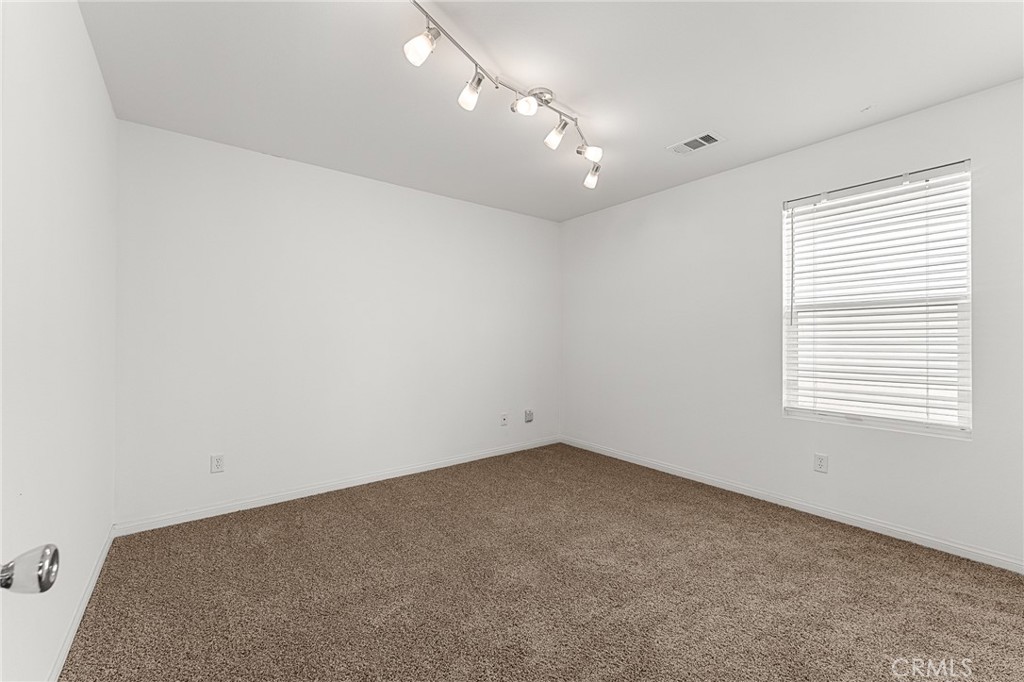 136 Yosemite Avenue Perris, CA 92570 - Photo 22 of 31 an empty room with a window