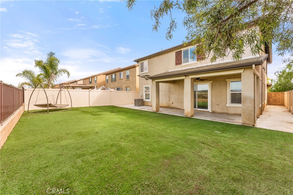 136 Yosemite Avenue Perris, CA 92570 - Photo 29 of 31 a view of a house with a yard
