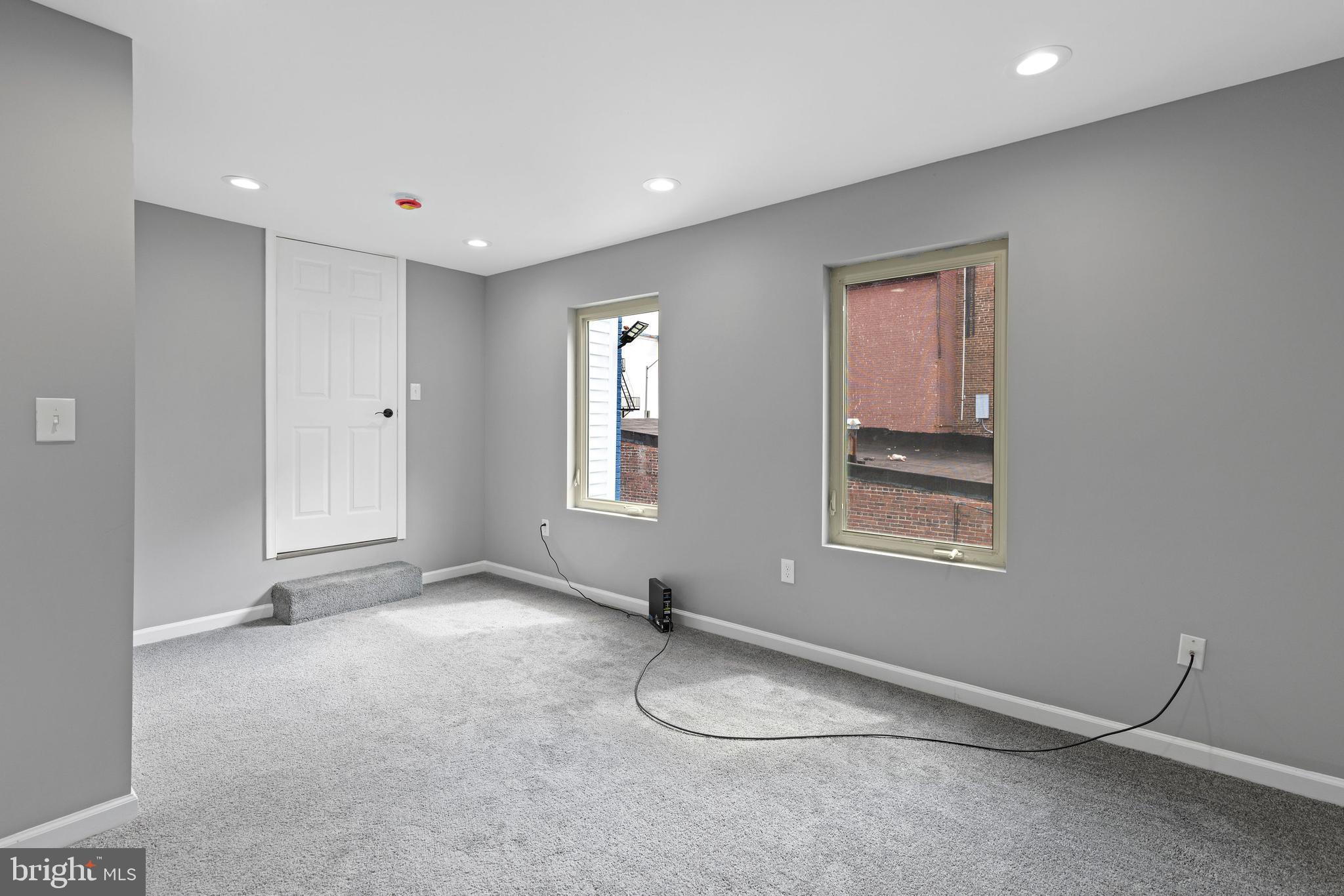 1809 West Lombard Street Baltimore, MD 21223 - Photo 20 of 36 a view of an empty room with a window