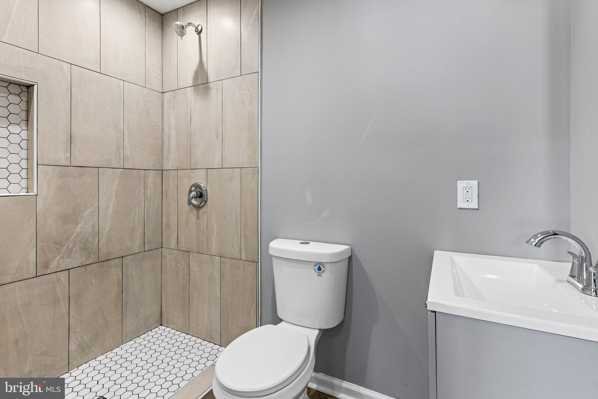 1809 West Lombard Street Baltimore, MD 21223 - Photo 24 of 36 a white toilet sitting next to a bathroom sink