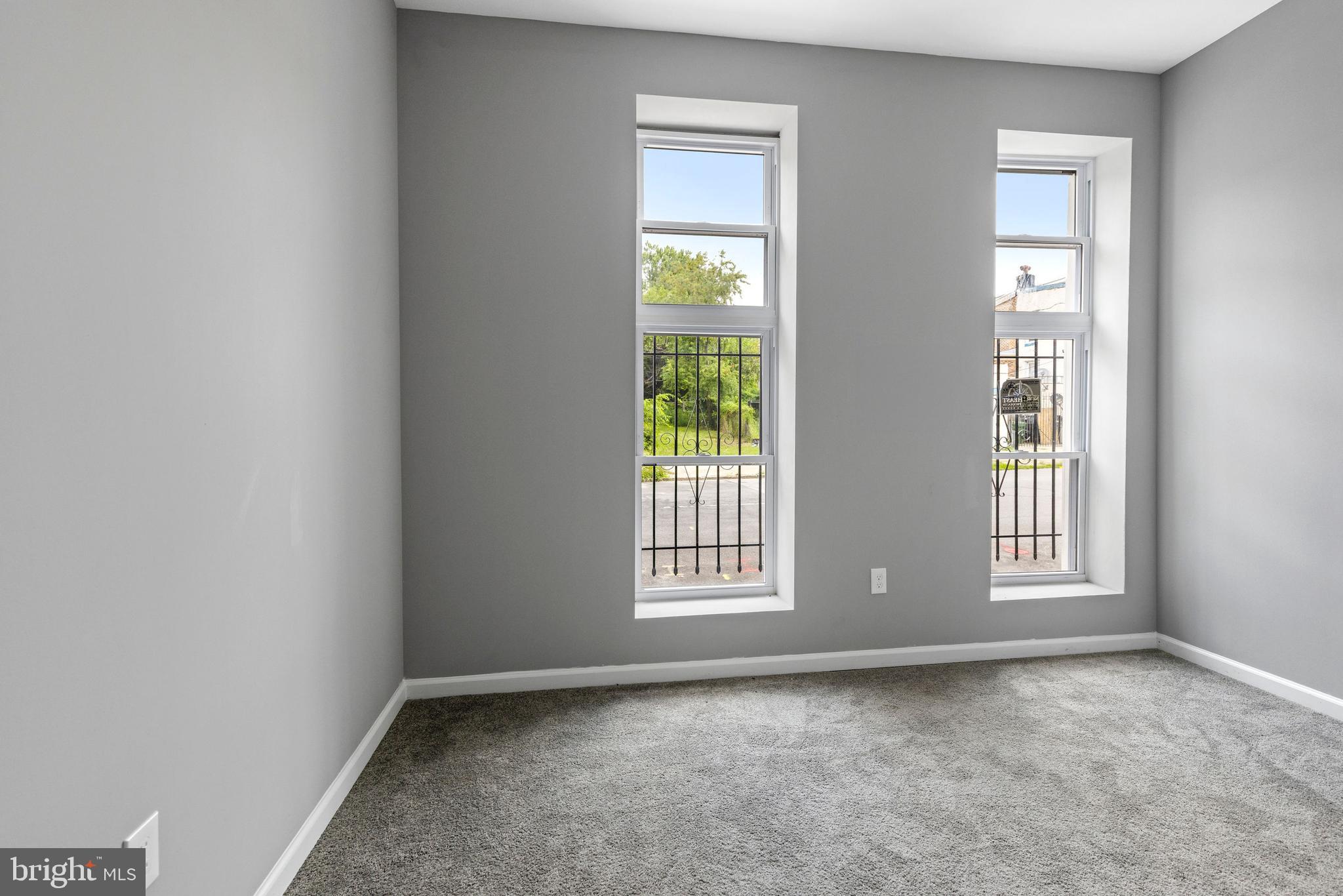 1809 West Lombard Street Baltimore, MD 21223 - Photo 4 of 36 a view of an empty room with a window