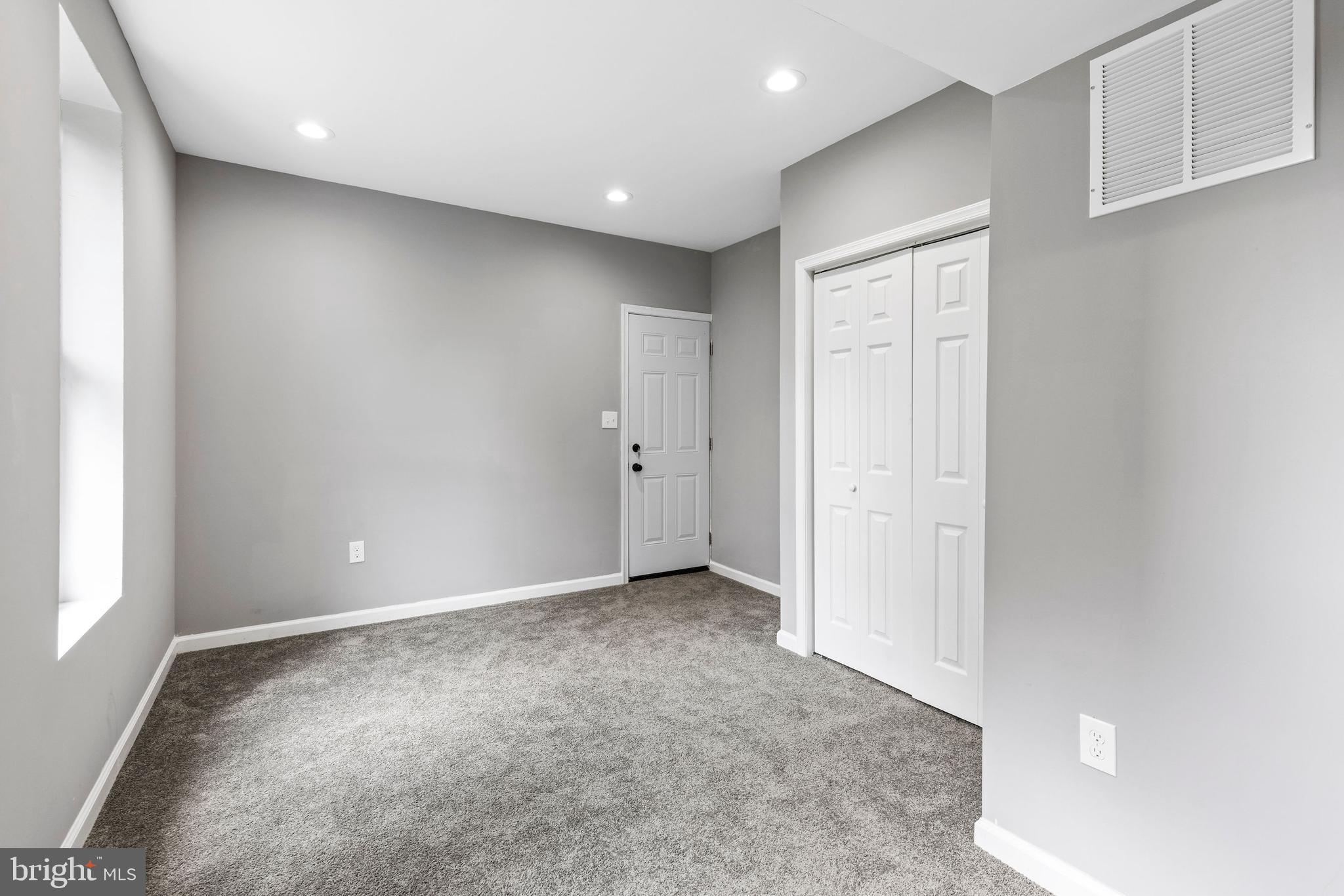 1809 West Lombard Street Baltimore, MD 21223 - Photo 9 of 36 an empty room with windows