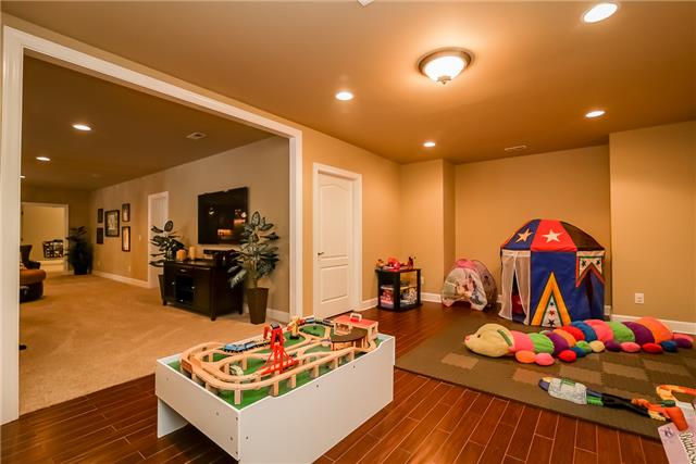 415 Ridgecrest Lane Lebanon, TN 37087 - Photo 20 of 20 Downstairs rec room/playroom with more storage. Room is wired and plumbed for a future kitchen