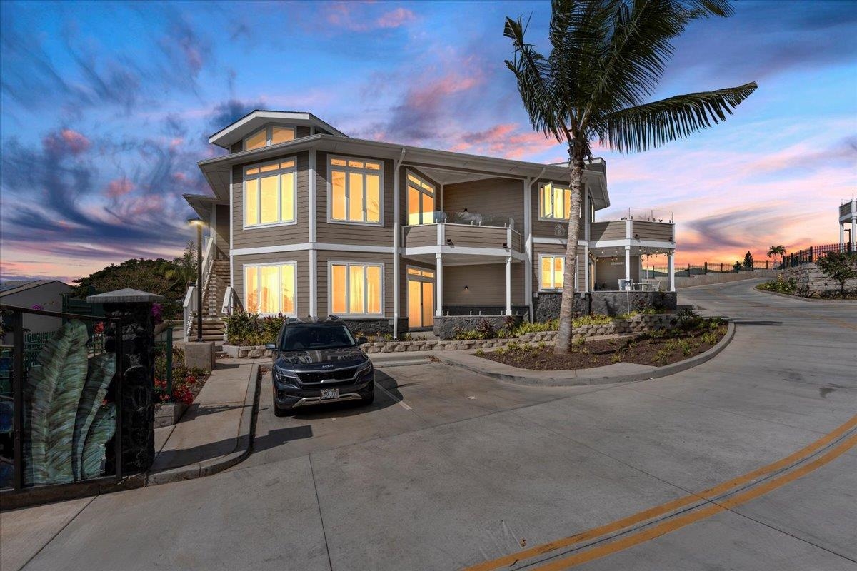 a front view of a house with sitting space