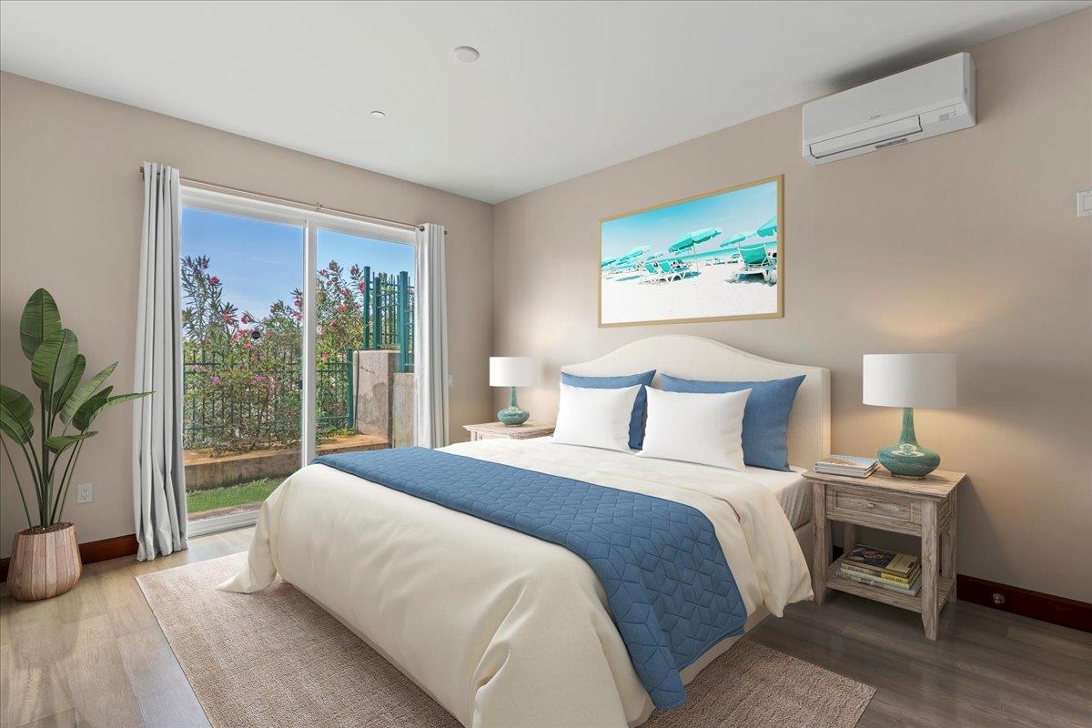 2757 South Kihei Road, Unit 801 Kihei, HI 96753 - Photo 24 of 41 a bedroom with a large bed and a large window