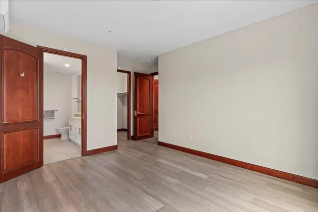 a bathroom with a sink a light fixture and a mirror