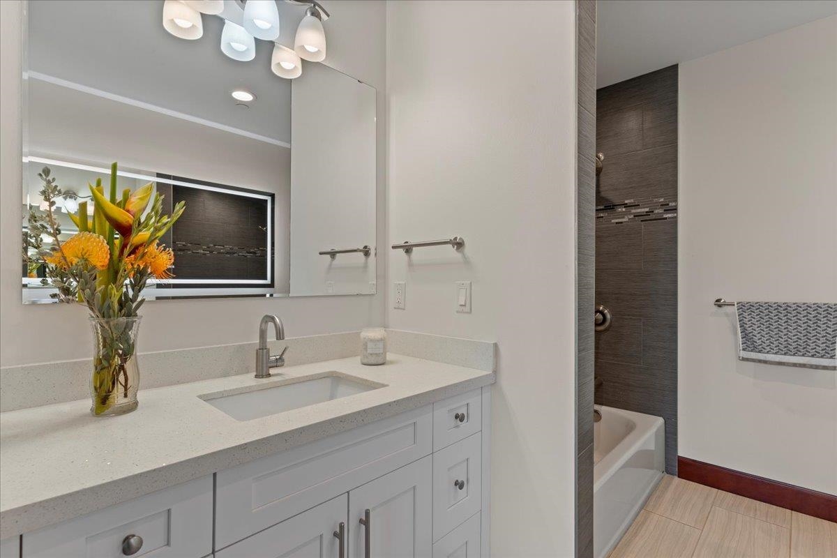 2757 South Kihei Road, Unit 801 Kihei, HI 96753 - Photo 28 of 41 a bathroom with a sink a light fixture and a mirror