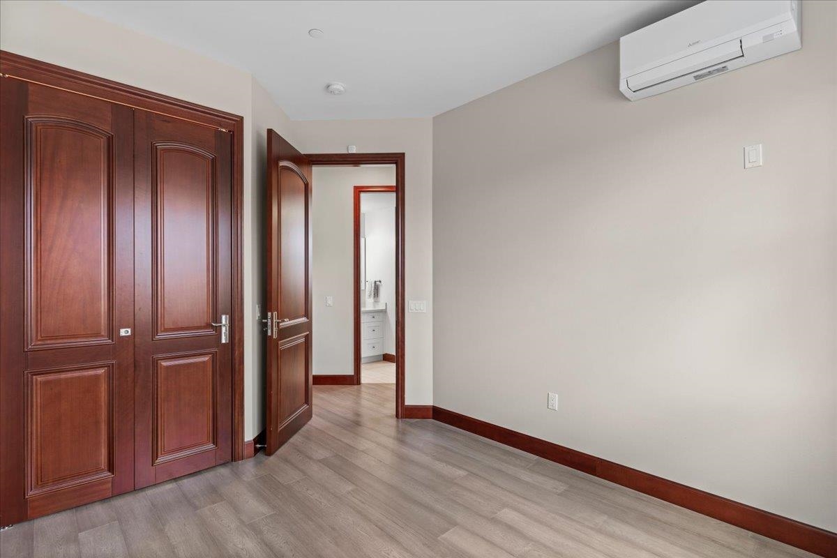 2757 South Kihei Road, Unit 801 Kihei, HI 96753 - Photo 36 of 41 an empty room with wooden floor and closet