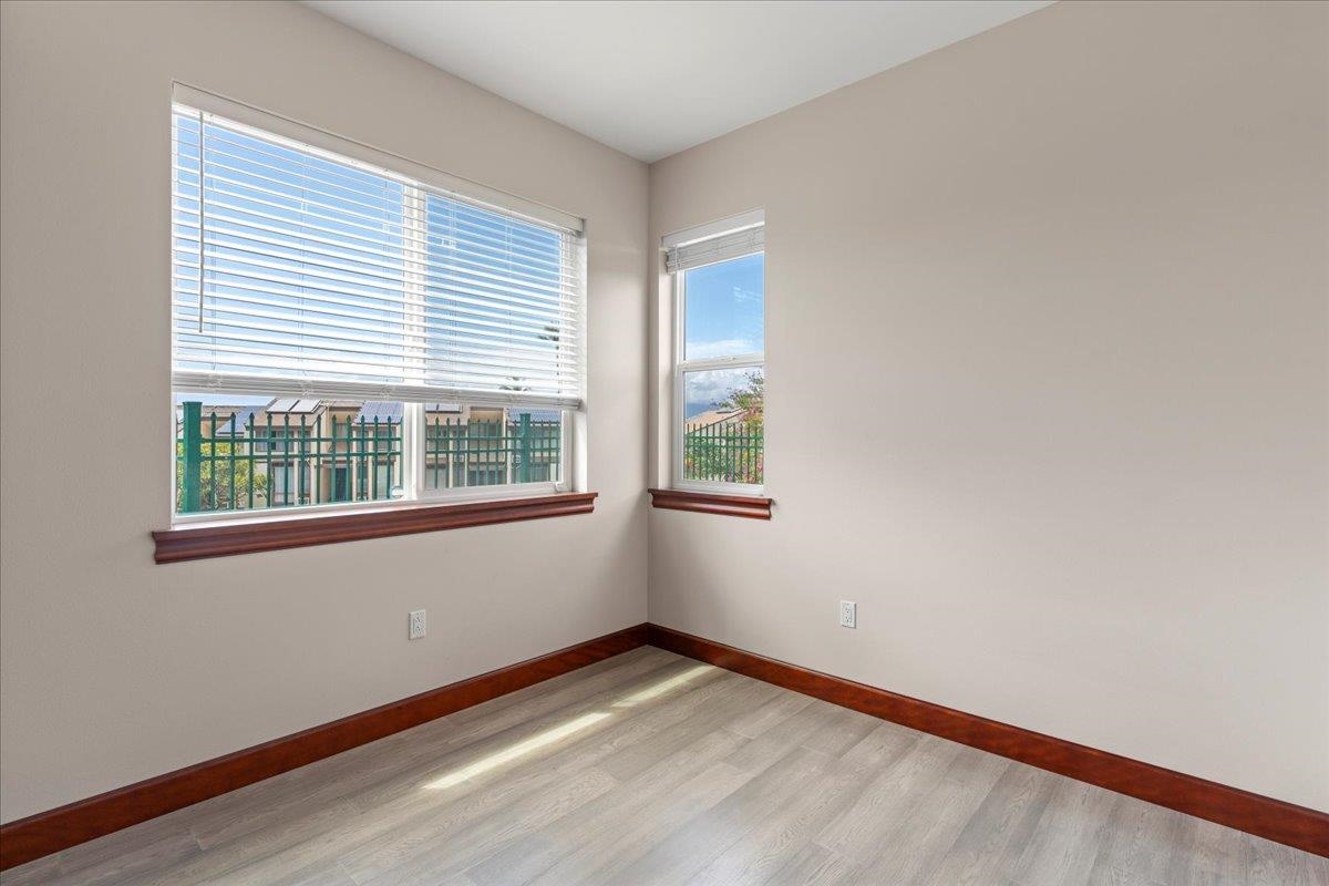 2757 South Kihei Road, Unit 801 Kihei, HI 96753 - Photo 40 of 41 a view of an empty room with wooden floor and a window