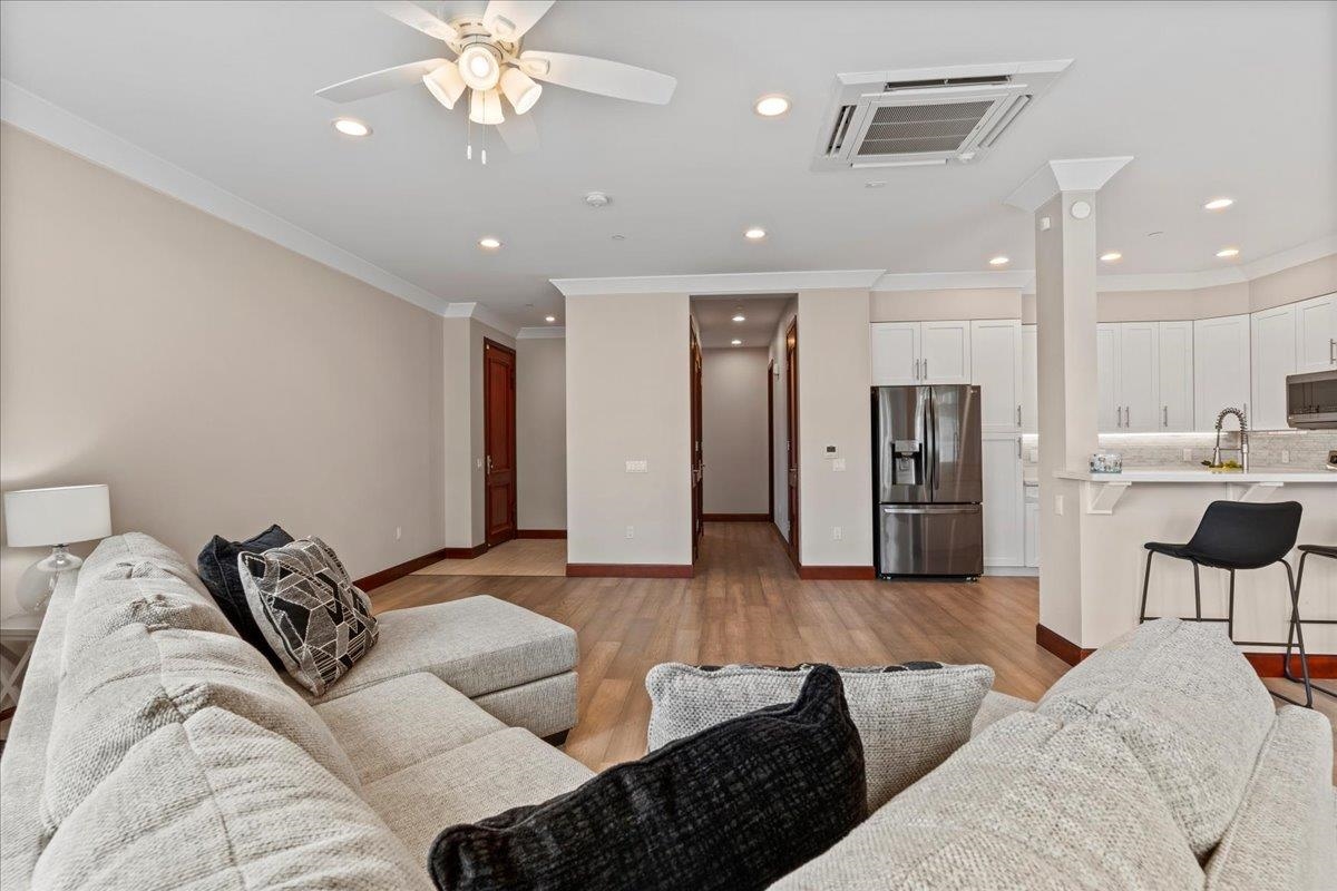 2757 South Kihei Road, Unit 801 Kihei, HI 96753 - Photo 7 of 41 a living room with furniture and kitchen view