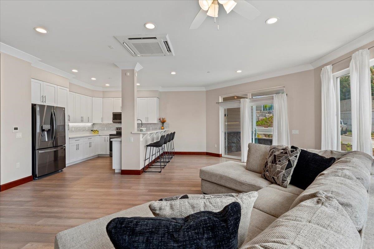 2757 South Kihei Road, Unit 801 Kihei, HI 96753 - Photo 8 of 41 a living room with furniture kitchen and a refrigerator