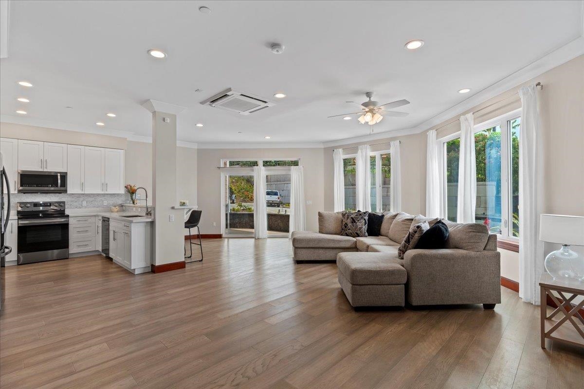 2757 South Kihei Road, Unit 801 Kihei, HI 96753 - Photo 9 of 41 a living room with furniture and wooden floor