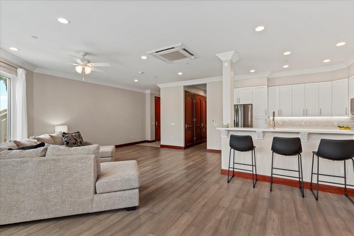 2757 South Kihei Road, Unit 801 Kihei, HI 96753 - Photo 10 of 41 a living room kitchen with furniture and kitchen view