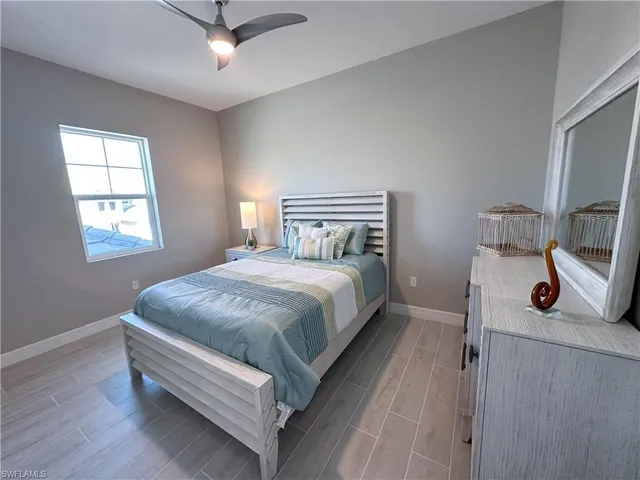 a bed room with a bed and a window