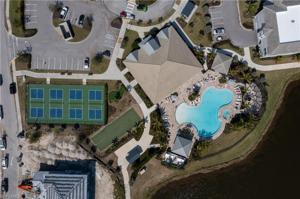 262 Indies Drive East, Unit 201 Naples, FL 34114 - Photo 44 of 45 an aerial view of a house with a swimming pool