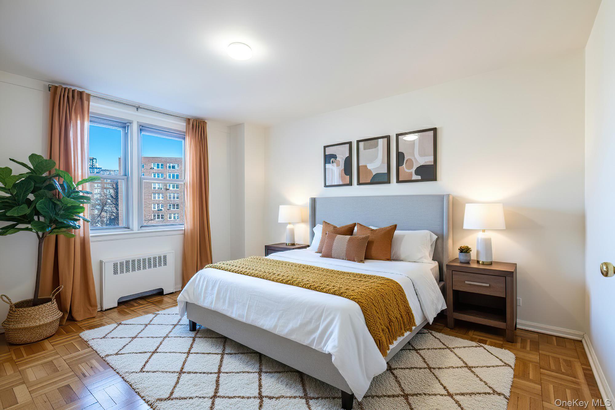 25 Knolls Crescent, Unit 9E Bronx, NY 10463 - Photo 12 of 23 Bedroom featuring radiator heating unit