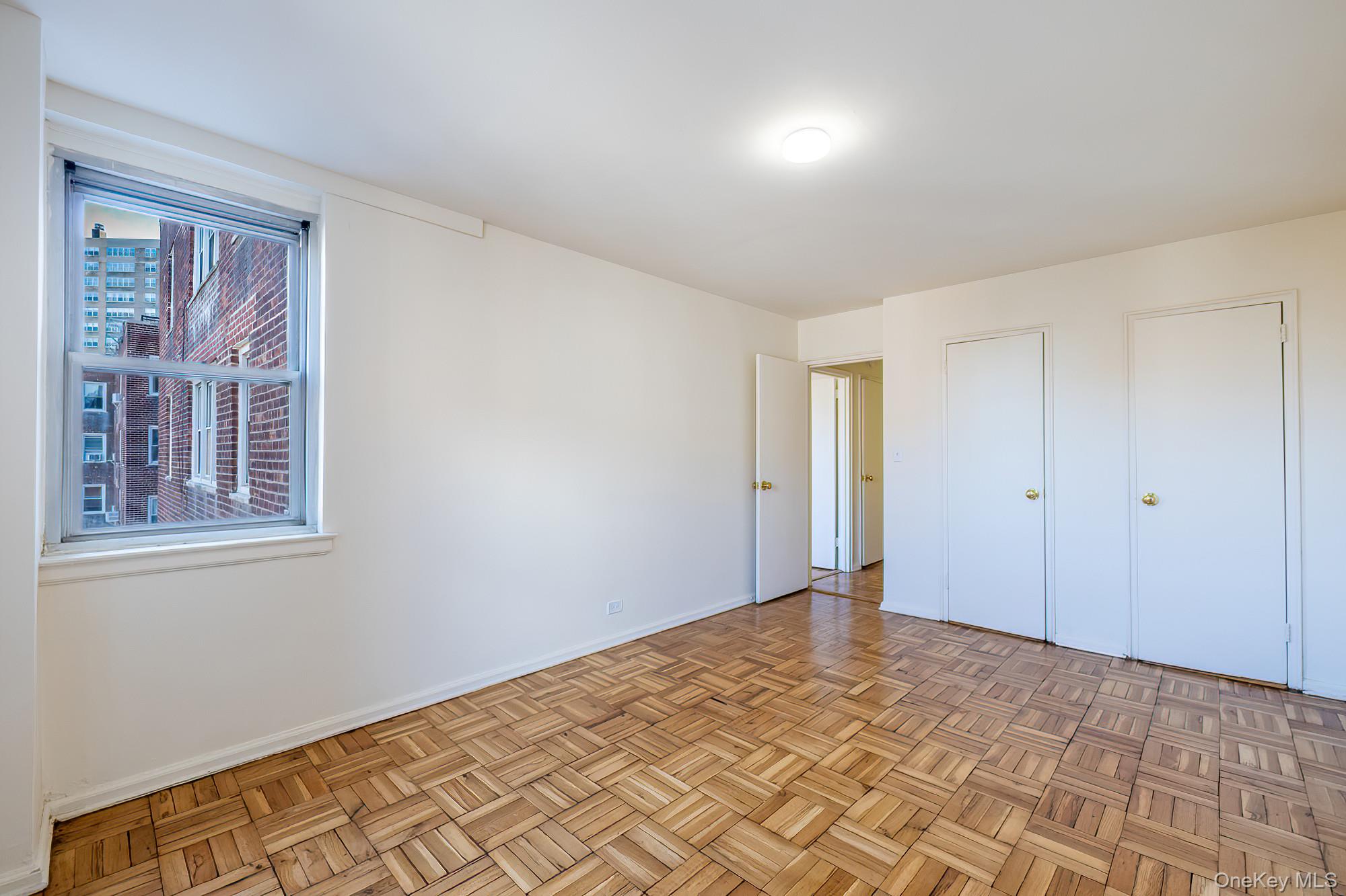 25 Knolls Crescent, Unit 9E Bronx, NY 10463 - Photo 14 of 23 Unfurnished bedroom with baseboards